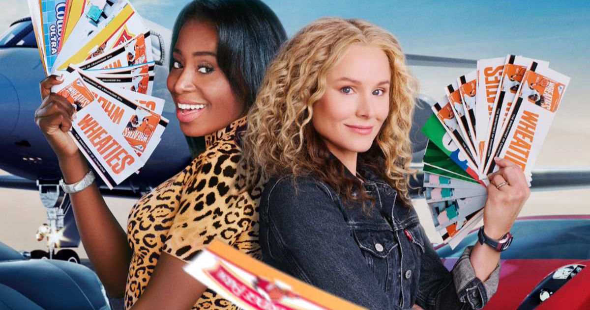 Kristen Bell and Kirby Howell-Baptiste hold coupons