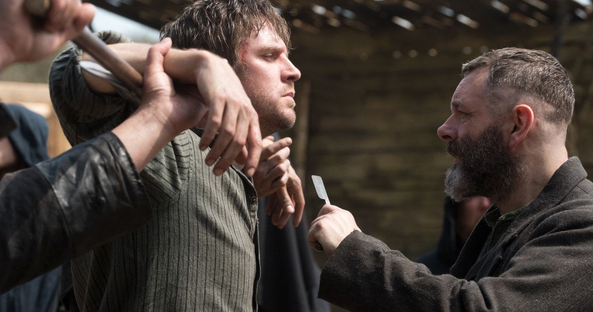 Michael Sheen and others grab Dan Stevens and torture him in Apostle
