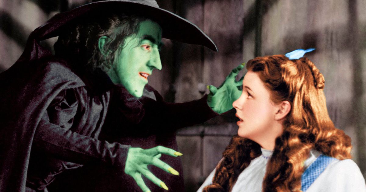 The green Wicked Witch of the West intimidates Dorothy in  The Wizard of Oz.