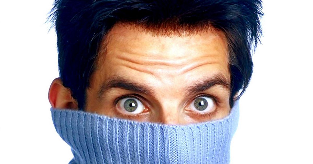 Ben Stiller with half of his face covered by a blue knit turtleneck in Zoolander