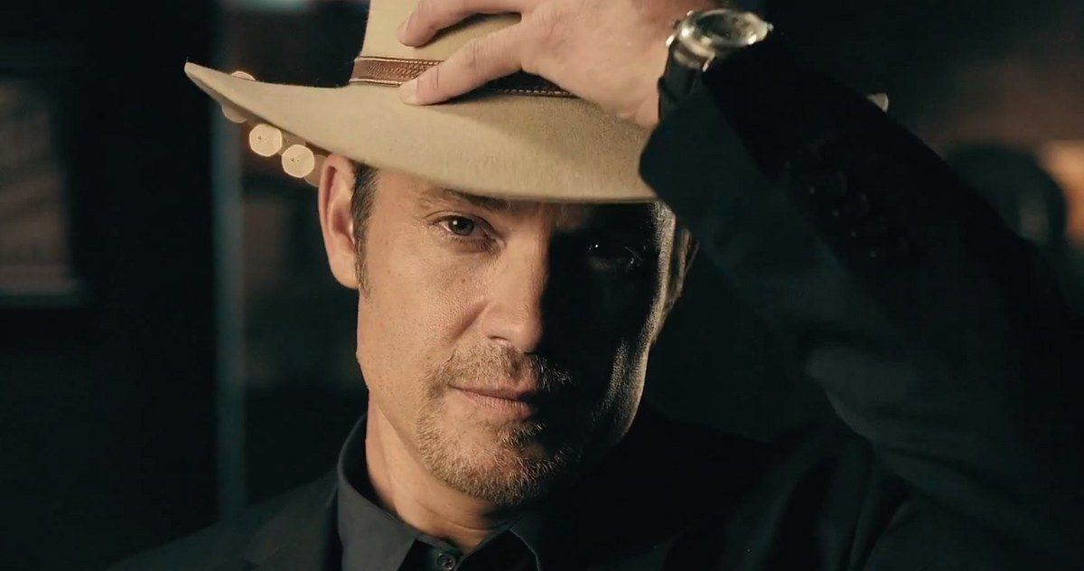 Timothy Olyphant straightens his hat in Justified