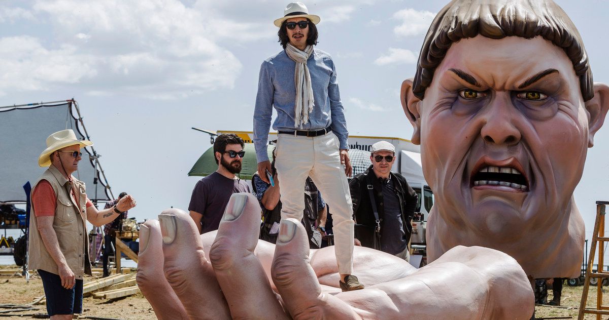 The Man Who Killed Don Quixote scene with Adam Driver standing in a big hand