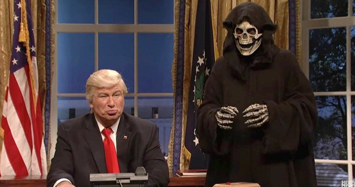 Alec Baldwin as Trump sits in front of Death in Saturday Night Live