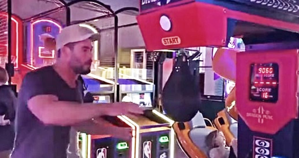 Watch Chris Hemsworth Prove His Thor Strength Against an Arcade Game