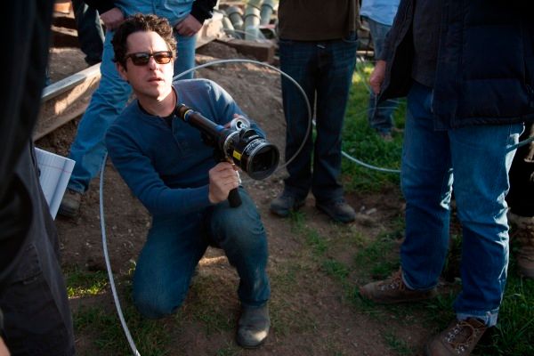 J.J. Abrams on the set of Super 8Earlier today we {0} the Super Bowl TV spot for {1}, the first footage that has been released so far for {2}' new movie. {3} also recently gave his first interview about the movie, and the first plot details were revealed, which you can read below.