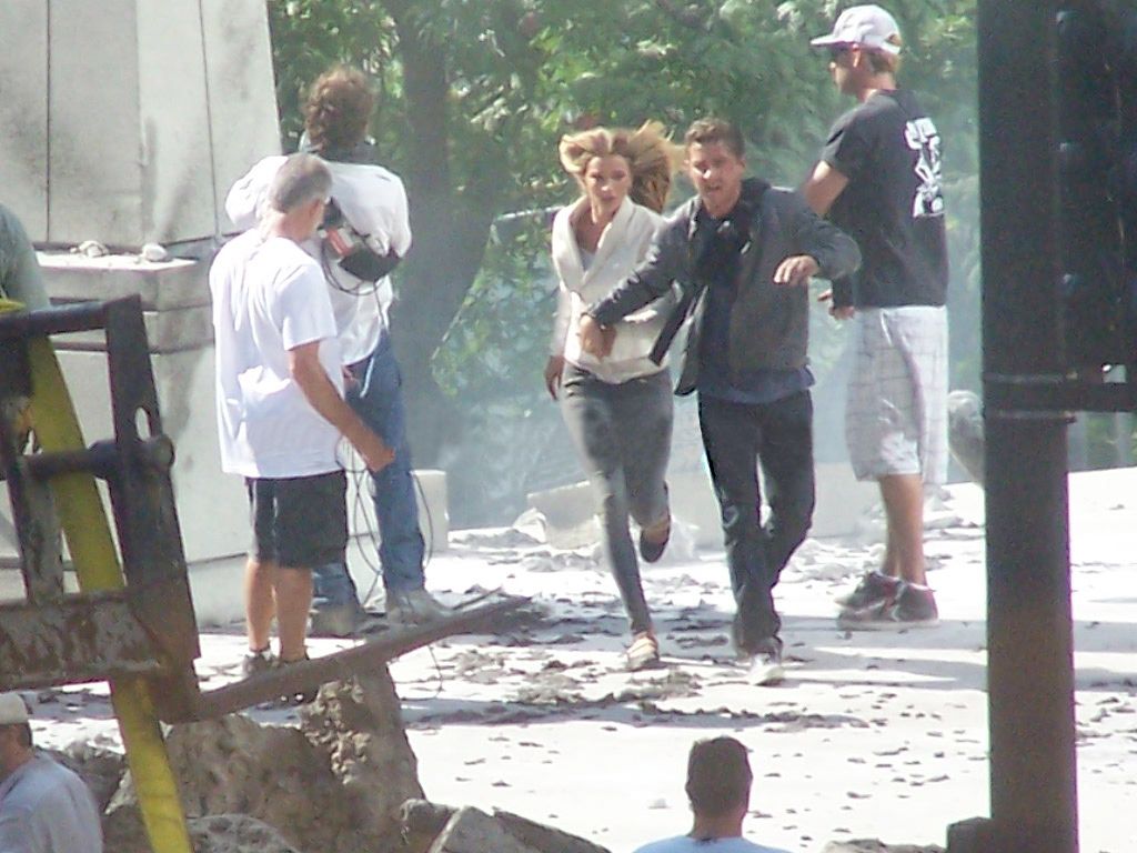 Shia LaBeouf and Rosie Huntington-Whiteley running from what has to be giant robots in Transformers 3