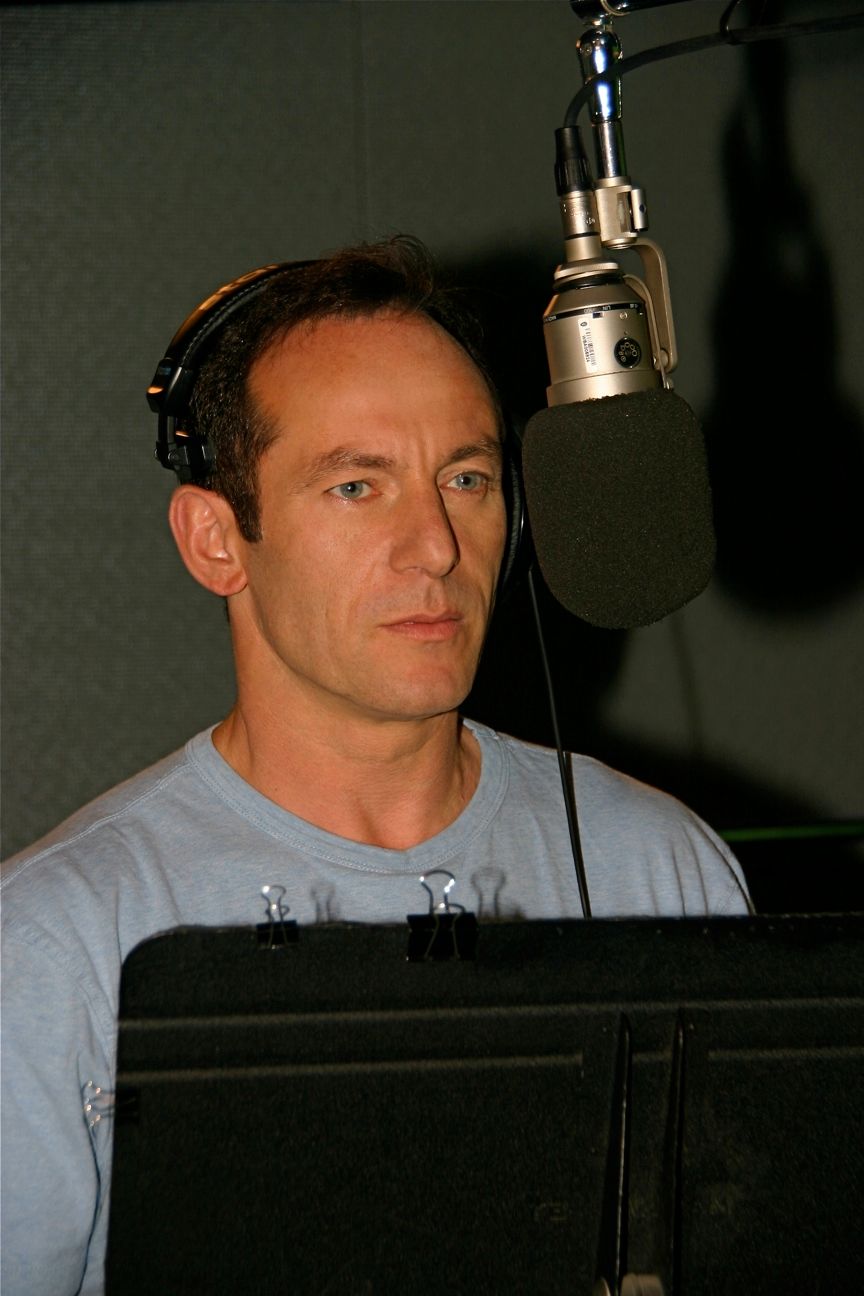 Jason Isaacs portrays Ra's al Ghul in Batman: Under the Red Hood{0} will be released on DVD, {1} and {2} on July 27 and the film features an impressive voice cast. One of those actors is {3}, who provides the voice of the villainous Ra's al Ghul in the film, and Warner Home Video has sent over an interview with the actor, who discusses his experiences on the film. Here's what he had to say.