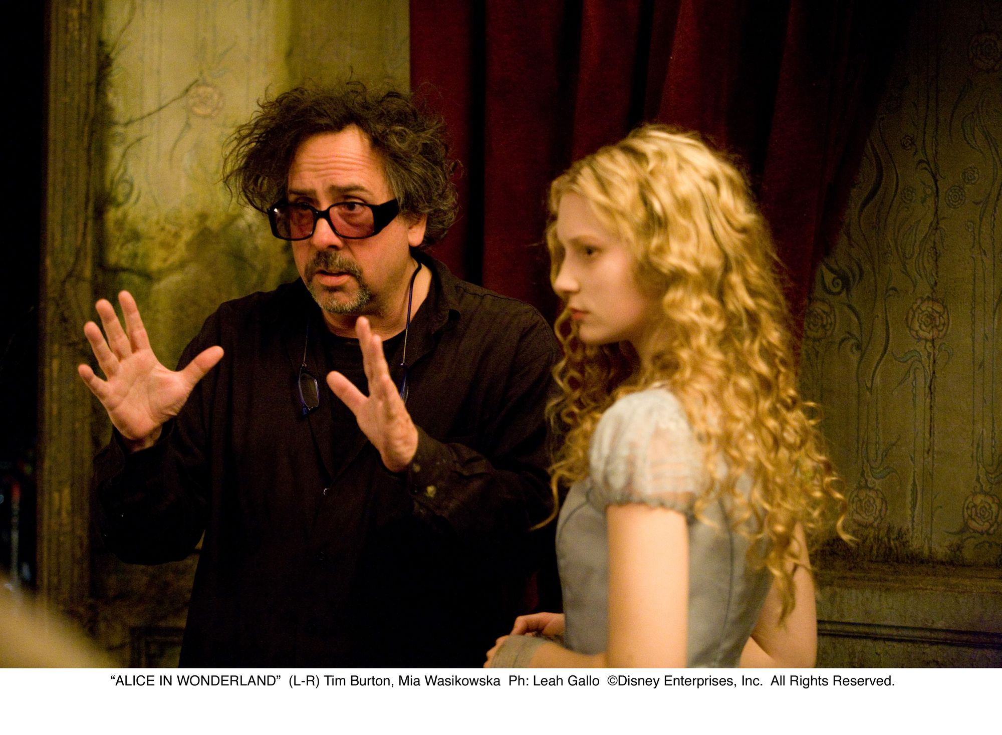 Tim Burton and Mia Wasikowska in Alice in Wonderland
