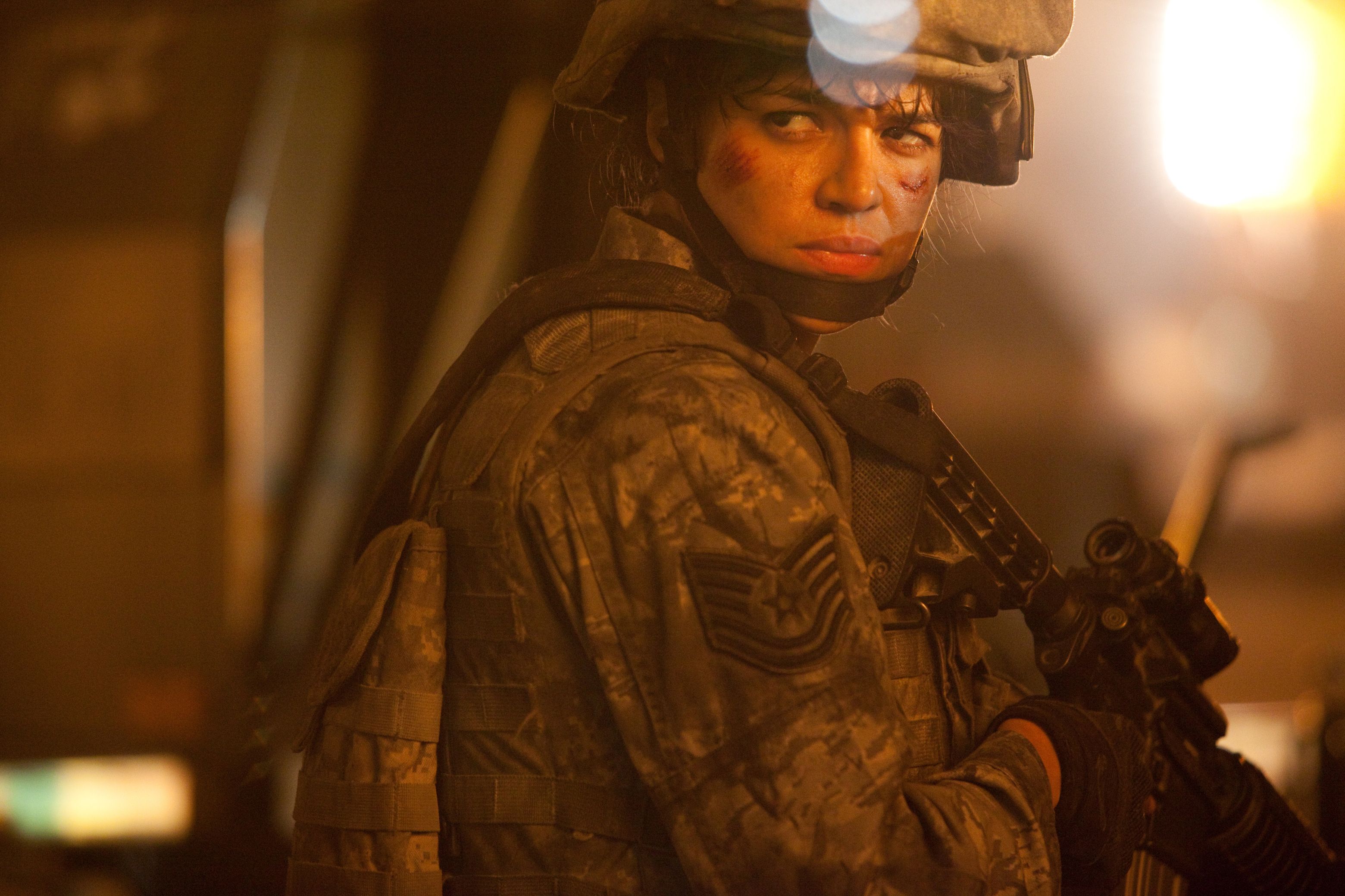 Michelle Rodriguez as Elena Santos in Battle: Los Angeles{57} He has a really refreshing, almost child-like enthusiasm. I've never met with a director who's as excited about what he's doing than {58}. It's really fun to watch because he still marvels at things that a lot of people take for granted in this business. If there's a big explosion, he's got twinkles in his eyes. He loves what he's doing and that's important. If somebody is heading up something they're bored with, it's contagious and h