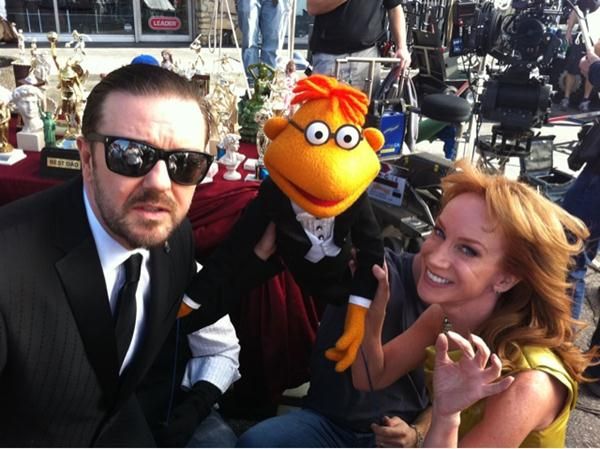 Ricky Gervais, the muppet Scooter and Kathy Griffin on The Muppets set