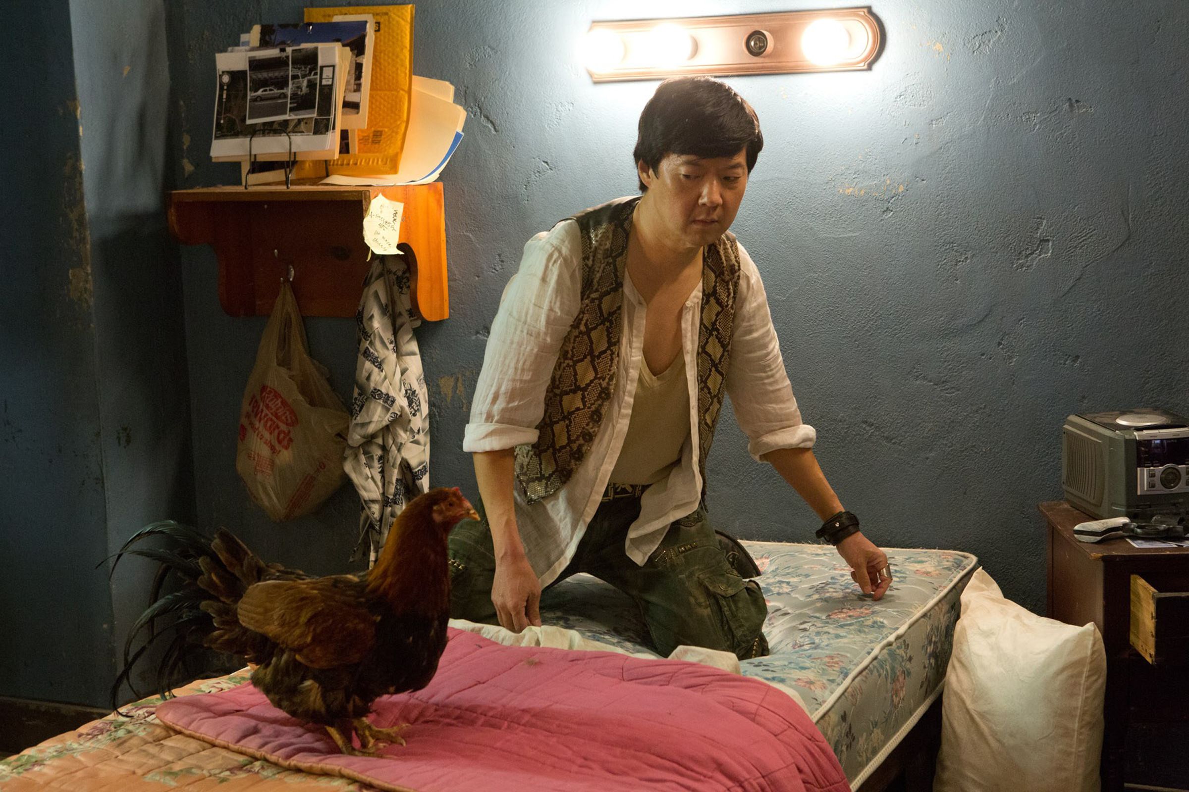 Ken Jeong's Mr. Chow gives dirty looks to a rooster in a scene from The Hangover Part IIIChow has most definitely evolved throughout the films, from being the crazy naked guy who Lops out of the trunk in {29}, to being Alan's plus-one at the wedding in {30}. The actor revealed that Chow is fully fleshed-out in this finale.