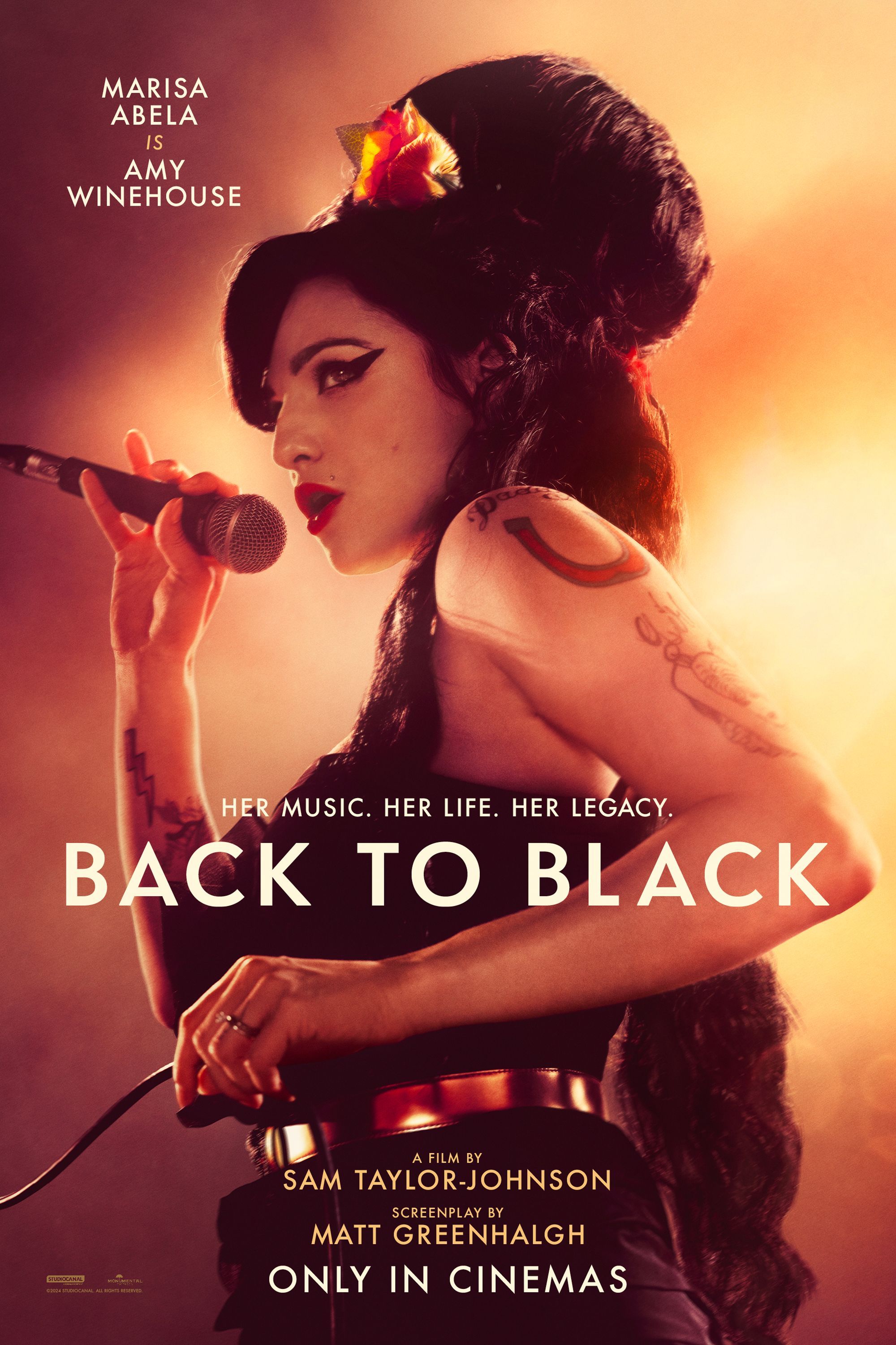 Back to Black Movie Poster showing Marisa Abela as Amy Winehouse Holding a Microphone